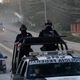 Federal police vehicles patrol Teloloapan, outside Iguala, Guerrero